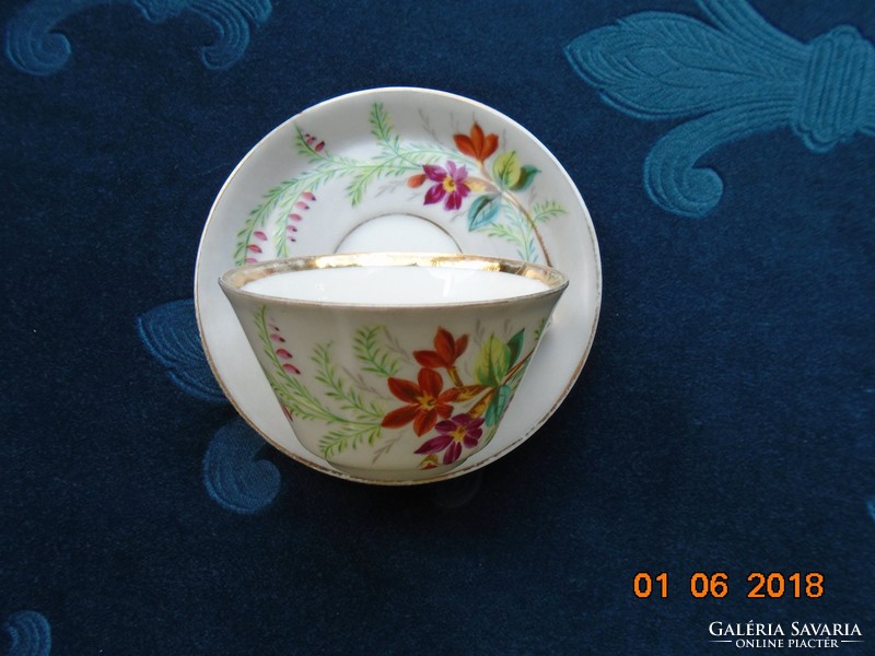 Hand-painted coffee cup with unique flower pattern over antique Art Nouveau glaze
