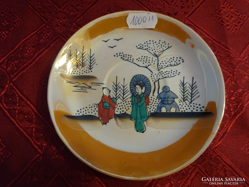 Japanese porcelain coffee cup placemat with green figure. He has!