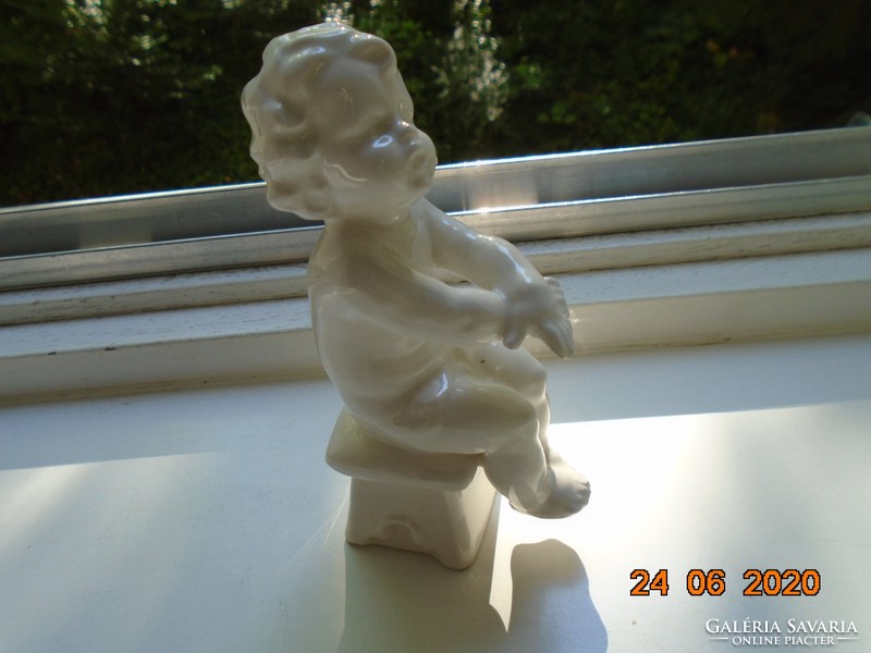 Antique numbered white glazed statue, 