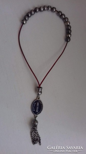 Prayer rosary prayer chain with fire enamel inscription medallion on it.