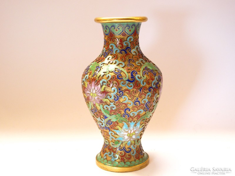 Gorgeous oriental compartment with enameled vase.