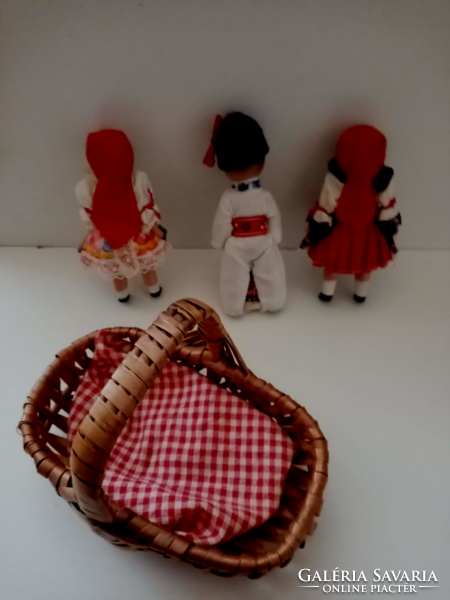 3- Pieces of a small rubber doll in old folk clothes in a small wicker basket for sale together
