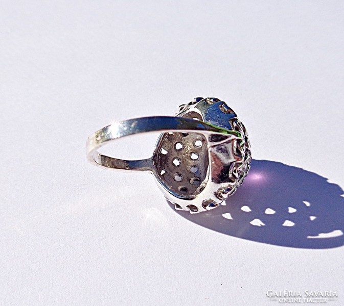 Purple stone ring with marcasite stones in a circle
