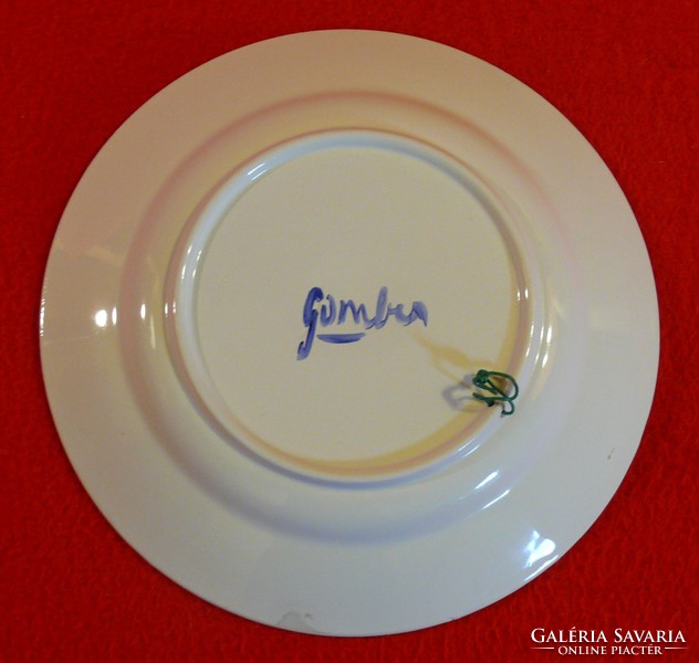 Blue patterned plate decorated with hand painting on a white background, 23.5 cm