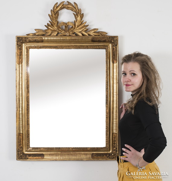 Gilded wooden framed mirror with laurel wreath decoration