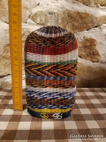Flat bottle decorated with wire braid,
