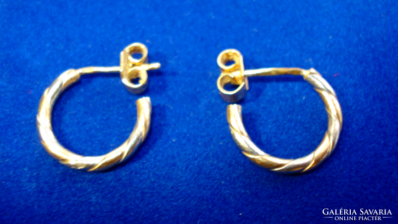 Pair of C-shaped earrings in yellow and white gold (18k)