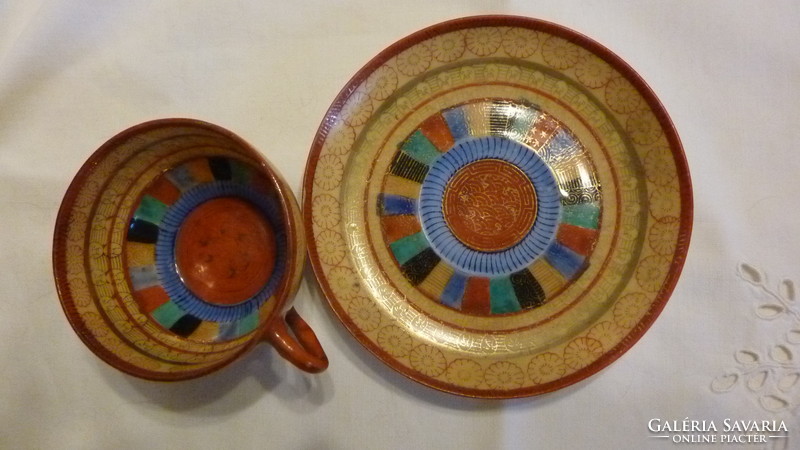 Oriental porcelain coffee cup and plate