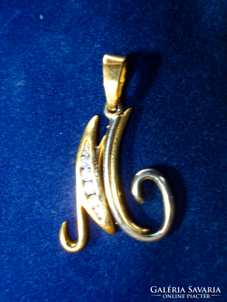 Antique white and yellow gold pendant in the shape of the letter m