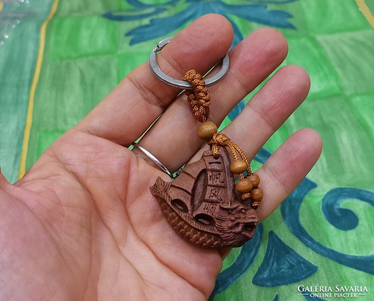 Real room. Feng shui rosewood key ring with dragon sailing