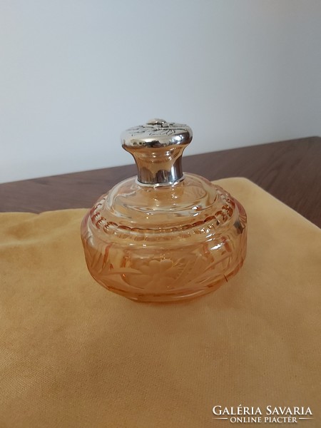 Engraved, polished peach colored vintage perfume bottle with marked silver rim and cap