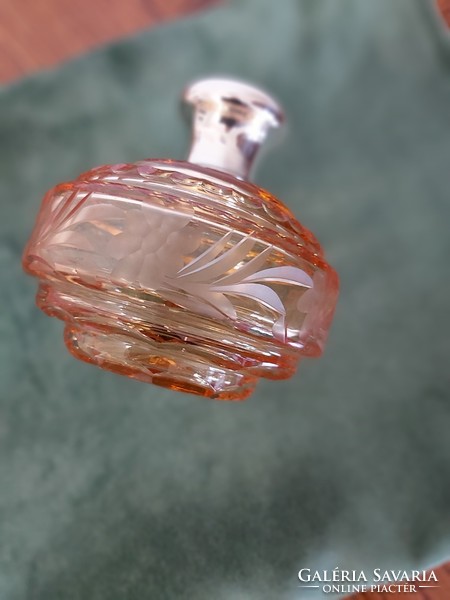Engraved, polished peach colored vintage perfume bottle with marked silver rim and cap