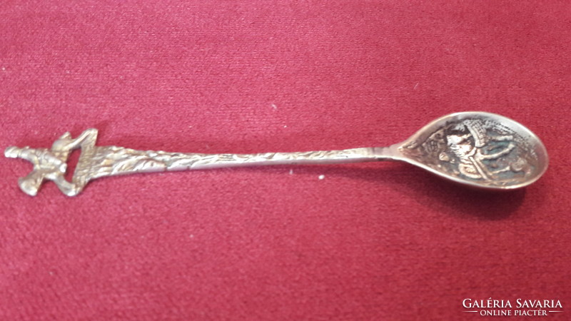 Old copper decorative spoon with relief pattern