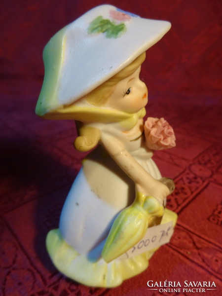 Porcelain figurine, lady with hat and umbrella, height 10 cm. He has!