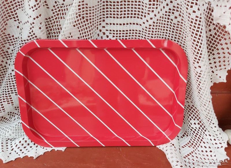 Retro metal plate tray with white stripes on a red background, collector's item, nostalgia enamel