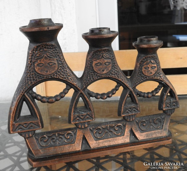 Industrial three-pronged figural bronze candlestick