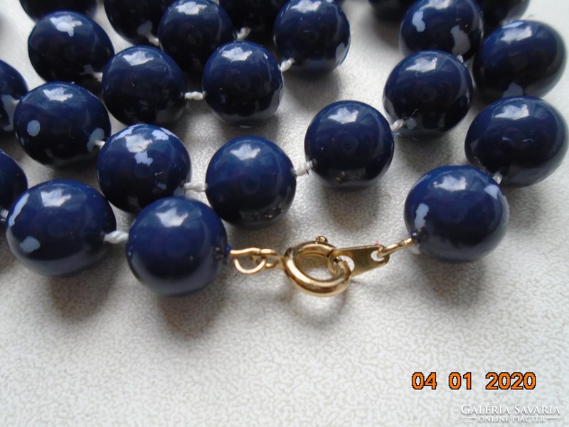 Necklace made of blue pearls with gold-plated clasp