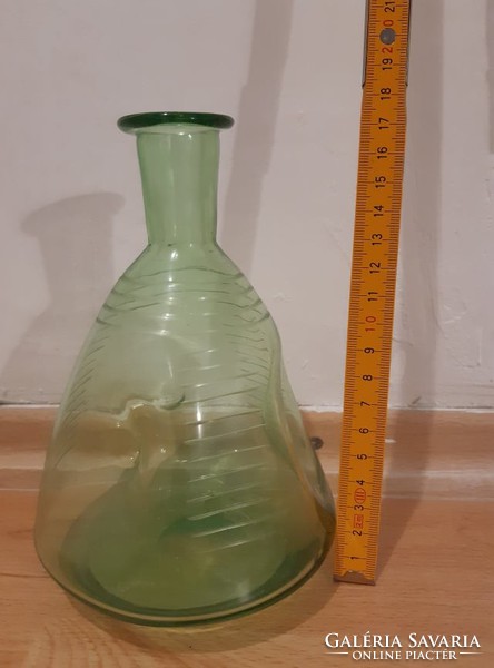 Glass bottle of liqueur blown into a mold