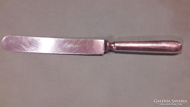 A knife with a silver-plated handle to make up for the gap