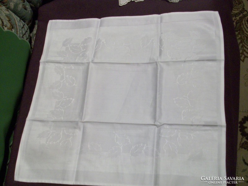 2 beautiful textile napkins with letter pattern. 46 X 46 cm.