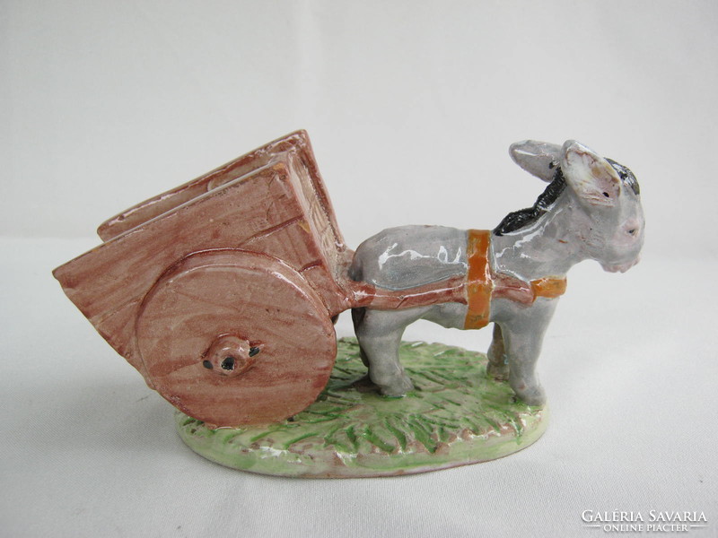 Donkey pulling a sweaty ceramic cord
