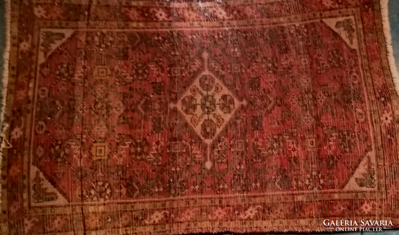Old hand-knotted wool carpet in beautiful colors.