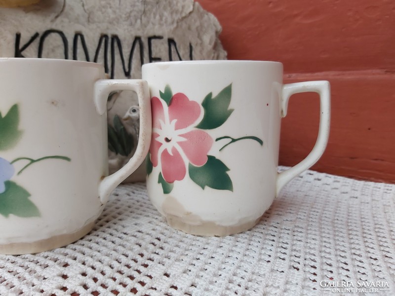 Beautiful granite mugs with flowers, nostalgic piece of village peasant decoration, vintage