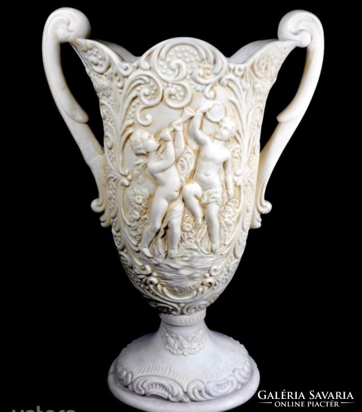 Large, bone-colored, heavy alabaster vase with putto and tendril pattern