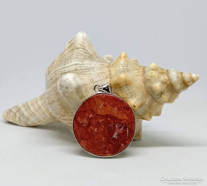 Red coral mineral pendant in silver socket