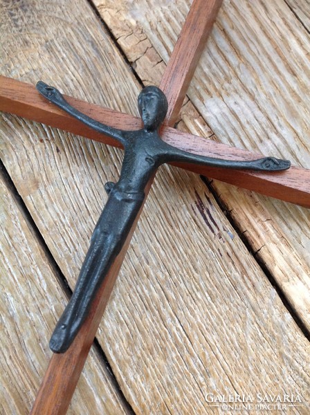 Old wooden crucifix with cast iron body