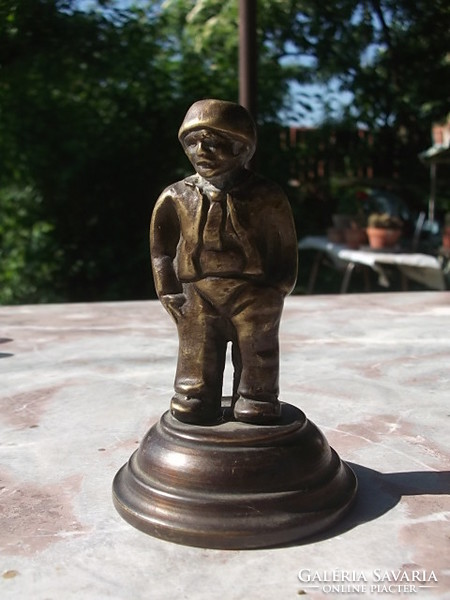 A bronze statue of a male figure for a desk, decoration