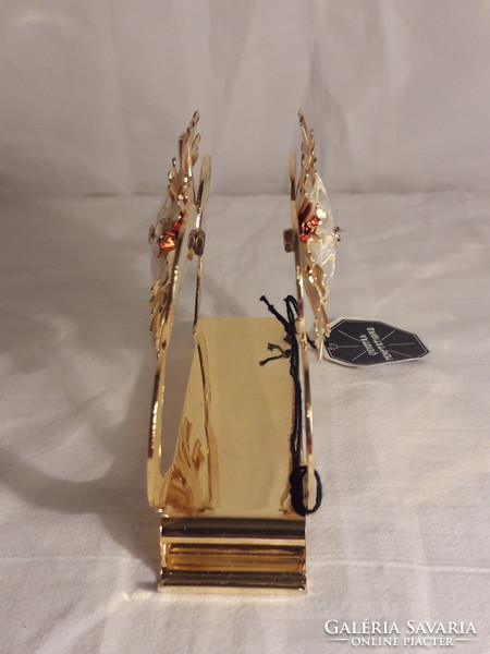 Gold color or gilded napkin holder with swarovski crystal middle ornament in new condition