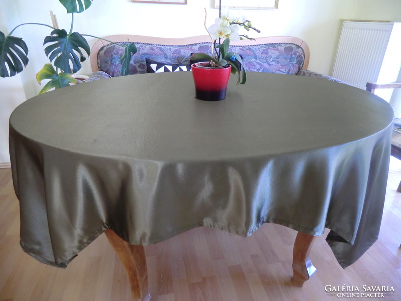 Showy and elegant color scheme with good fall. Heavy silk olive green 150x180 tablecloth