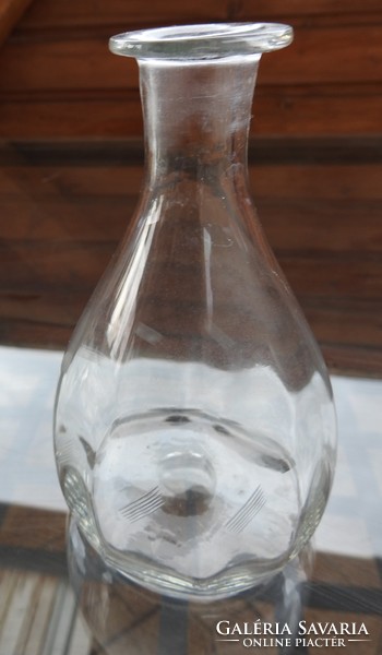 Broken glass bottle with polished decoration