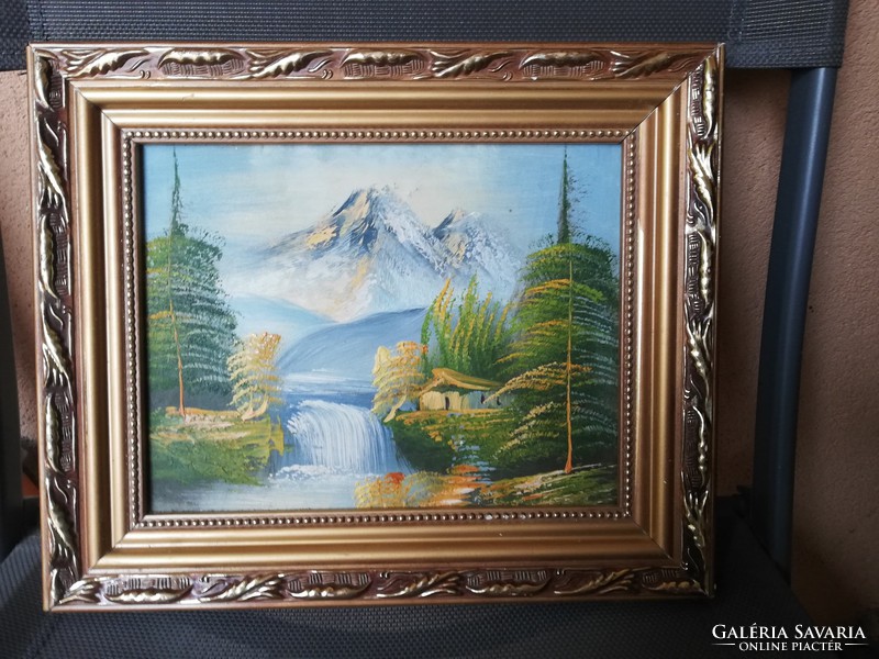 Oil on canvas landscape in ornate wooden frame