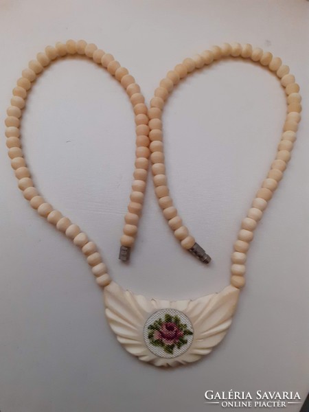 Retro beautiful condition necklace with carved bone medallion adorned with tapestry with screw switch