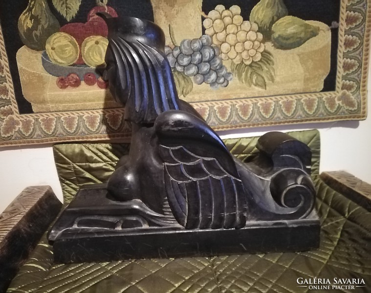 Antique carved sphinx couple