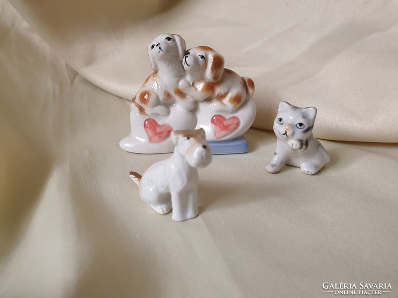 Porcelain cat and dog trio