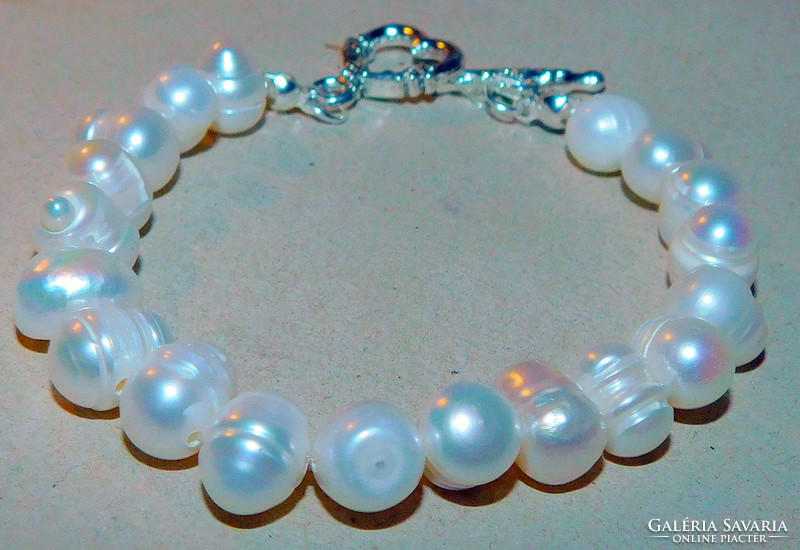 Off-white round eyed real pearl bracelet with ornate clasp
