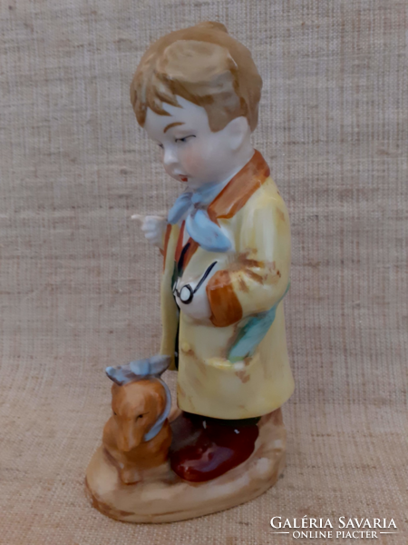 Old sealed numbered German porcelain boy with dog