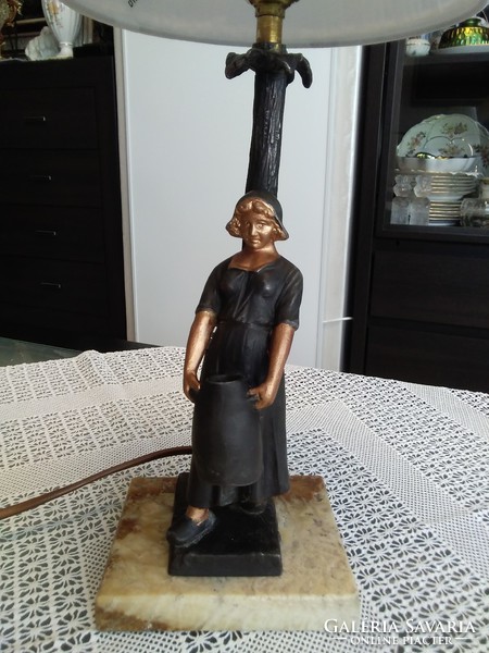 Old bedside lamp on a marble base with a cast metal female figure.
