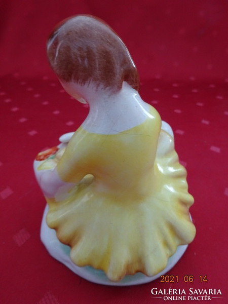 Bodrogkeresztúr porcelain figurine, a girl in a yellow dress with a flower. Its height is 11 cm. There are good ones. !