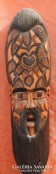 Old oriental wooden wall mask