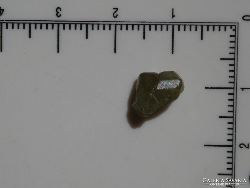 A piece of natural demantoid garnet. Raw mineral. Jewelry base material. 3.4 Ct