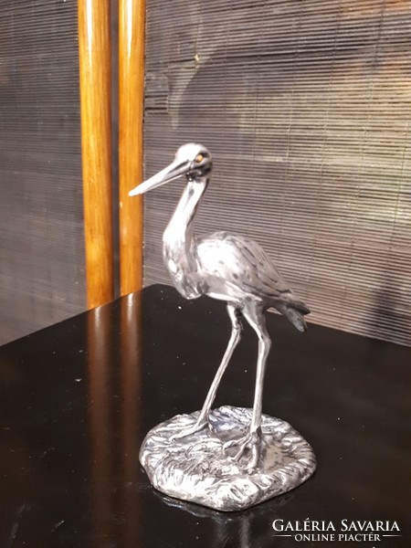 Silver stork statue