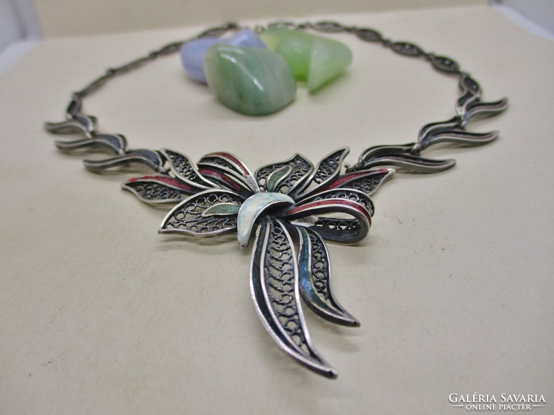 Beautiful old handmade silver necklaces with enameled floral decorations