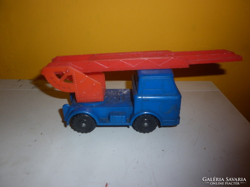 Old small plastic crane toy truck
