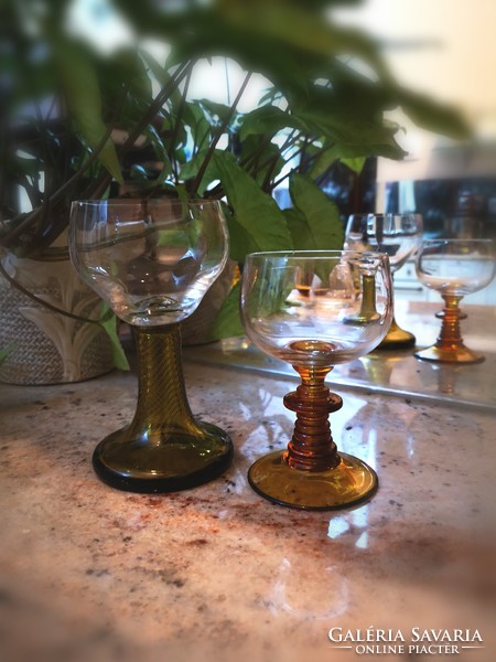 Crystal, amber-colored, handmade wine glasses with stems
