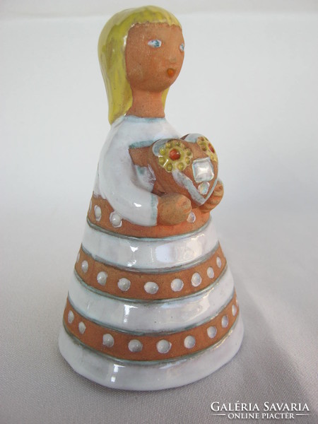 Signed ceramic little girl with a gingerbread heart