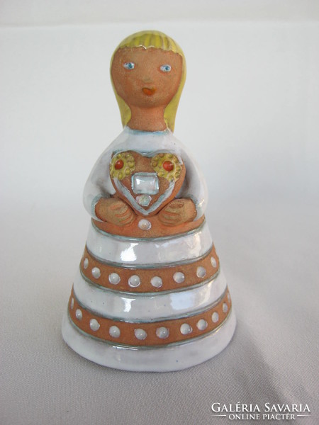 Signed ceramic little girl holding a gingerbread heart in her hand